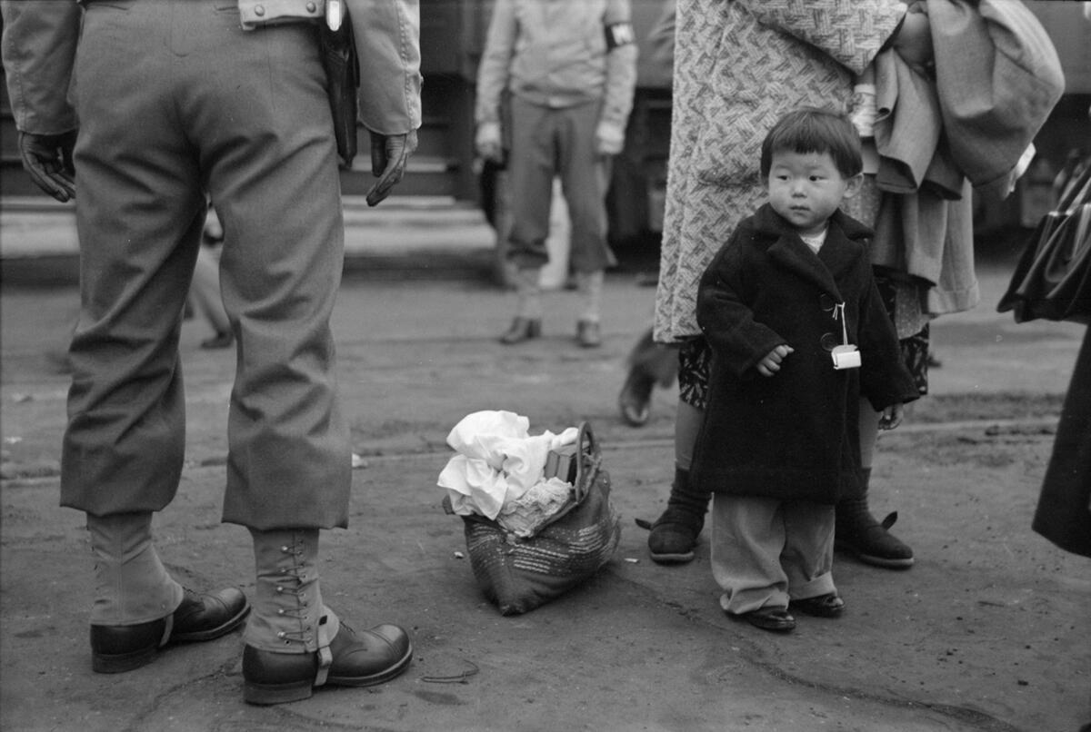 Forced Evacuation of a Japanese American Child, Los Angeles, 1942, by Russell Lee